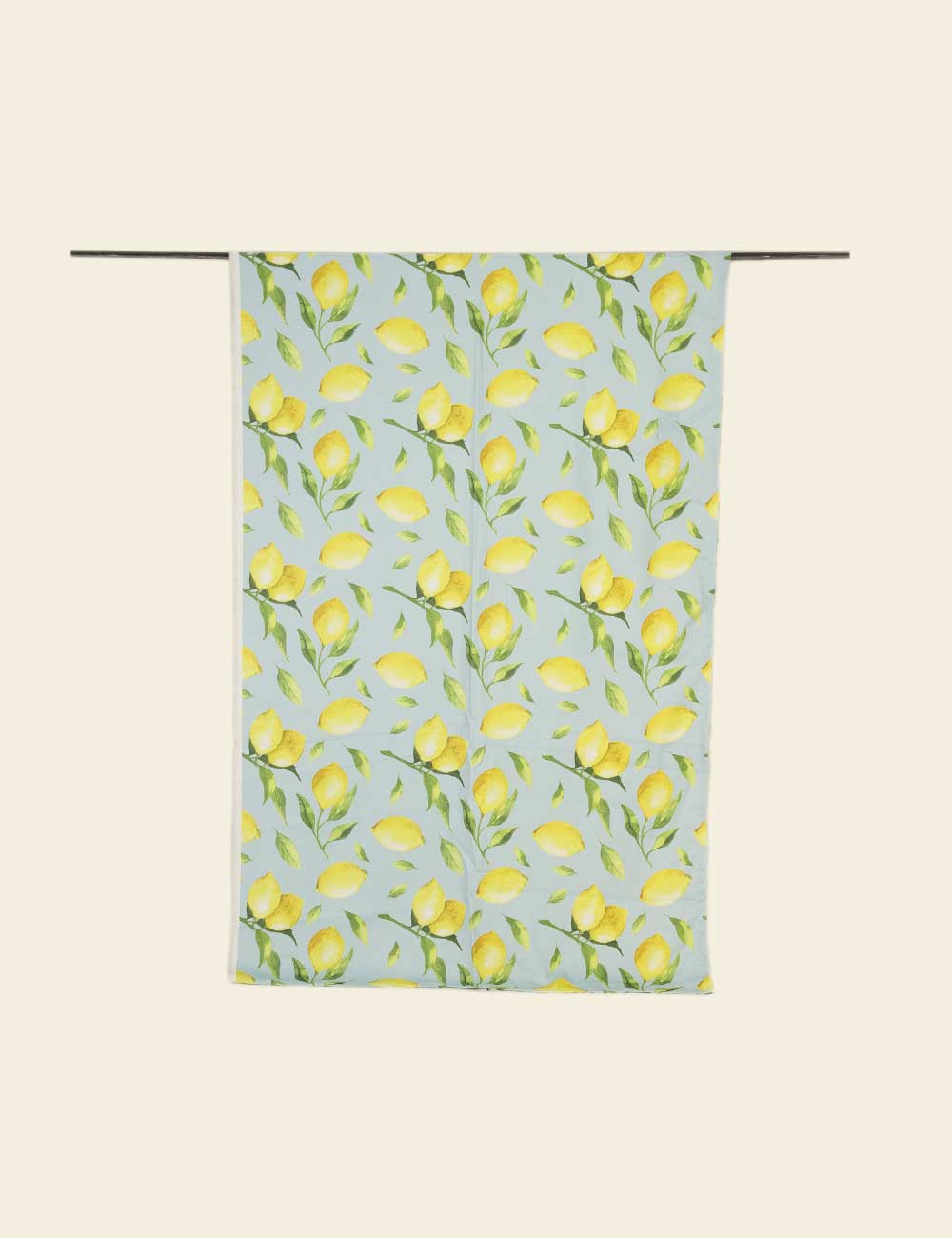 Tea towel with lemon pattern on a light blue background