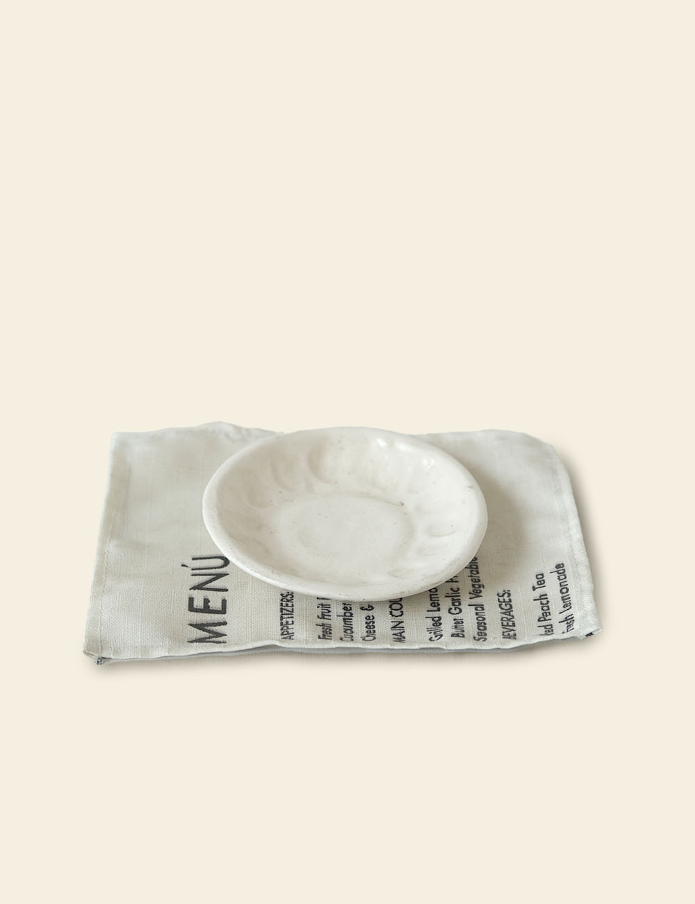 Off-White Ceramic Saucer and Menu